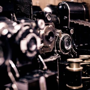 A close up of some old cameras and lenses